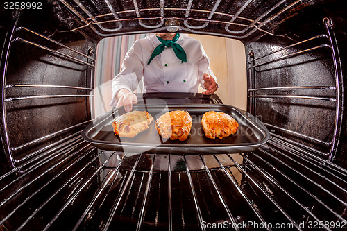 Image of Chef cooking in the oven.