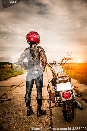 Image of Biker girl on a motorcycle