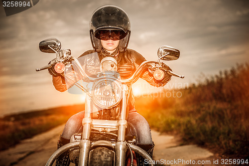 Image of Biker girl on a motorcycle