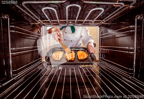 Image of Chef cooking in the oven.