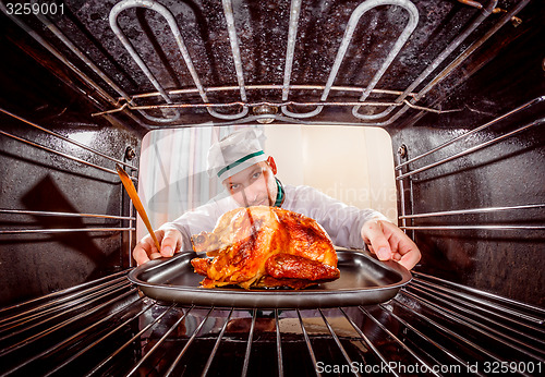 Image of Cooking chicken in the oven.