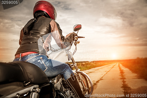 Image of Biker girl on a motorcycle