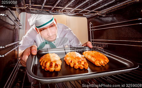 Image of Chef cooking in the oven.