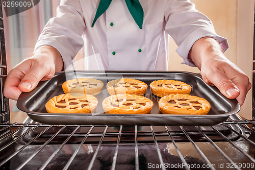 Image of Chef cooking in the oven.