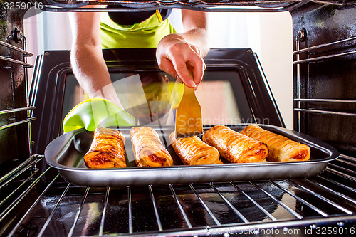 Image of Cooking in the oven at home.