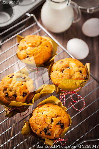 Image of Homemade muffins with baking ingredients