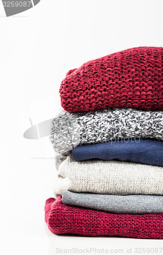 Image of Stack of handmade wool sweaters