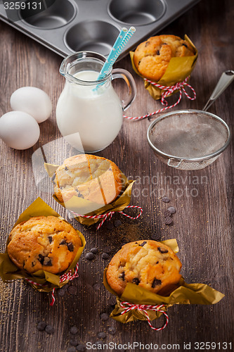 Image of Homemade muffins with baking ingredients