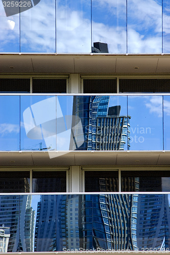 Image of reflex of some palace in  buenos aires  and a crane