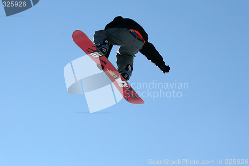 Image of Snowboarder jumping high