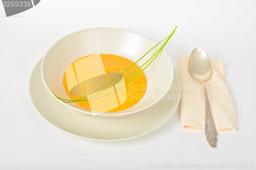 Image of Pumpkin cream soup with spoon