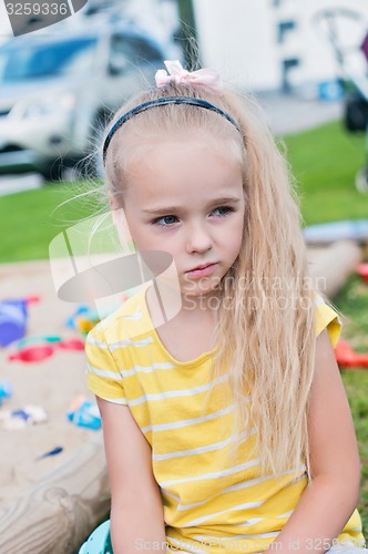 Image of Portrait of beautiful sad little girl