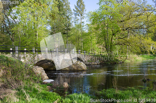 Image of Ancient bridge at small river
