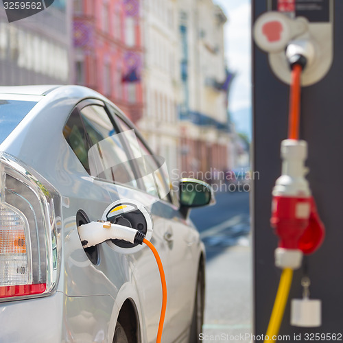 Image of Electric Car in Charging Station.