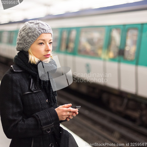 Image of Woman on a subway station.