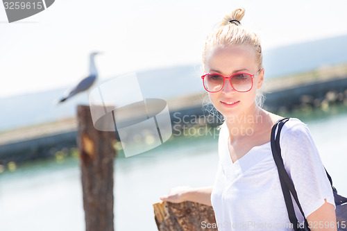 Image of Woman on the beach in summertime.