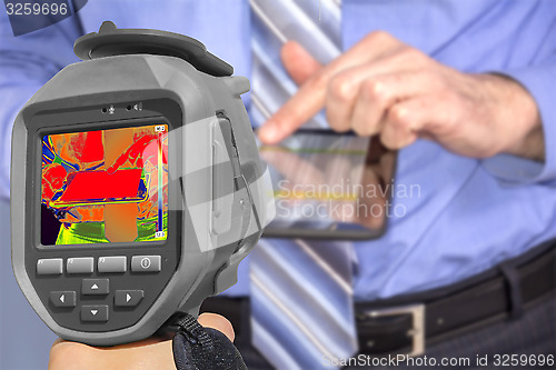 Image of Recording Businessman With Thermal Camera