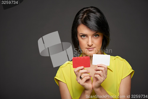 Image of Business woman showing blank credit cards