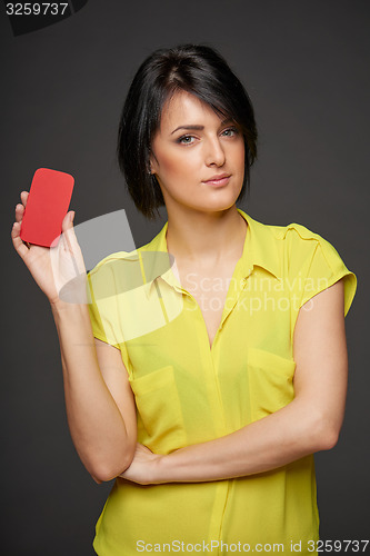 Image of Confident woman showing blank credit card