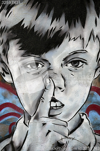 Image of Boy picking his nose