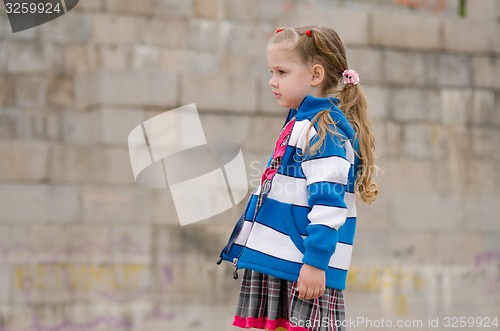 Image of Girl in a sweater looking to the left