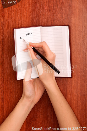 Image of writes notes