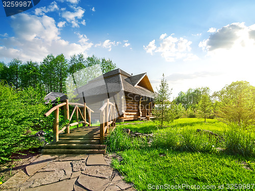 Image of Wooden bridge and house