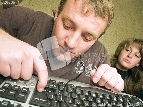 Image of The mad programmer with the keyboard. A funny picture