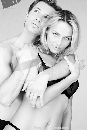 Image of Couple posing in undergarments