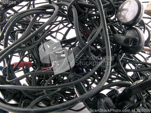 Image of Interlacing of the broken off wires of old headphones. backgroun