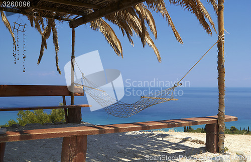 Image of hammock Swing on a tropical beach - vacation background