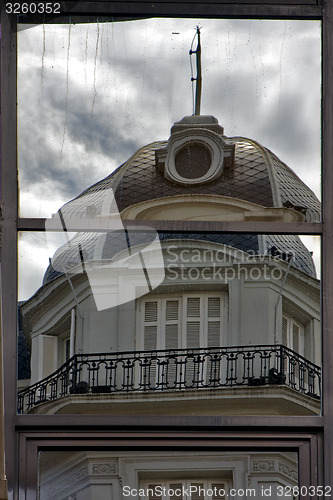 Image of reflex of a palace in a window