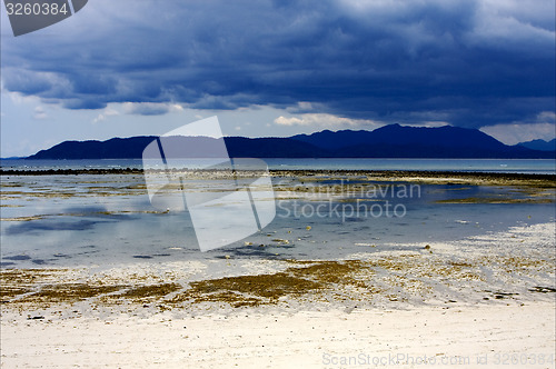 Image of sand isle and rock in indian ocean