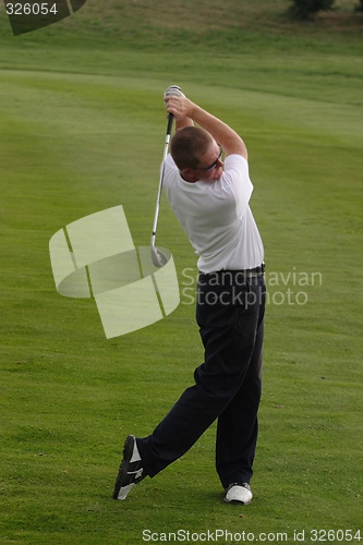 Image of Male golfer playing