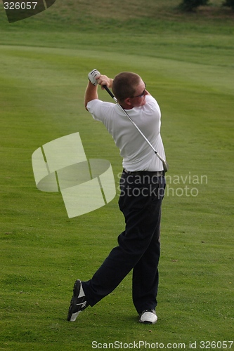 Image of Male golfer playing