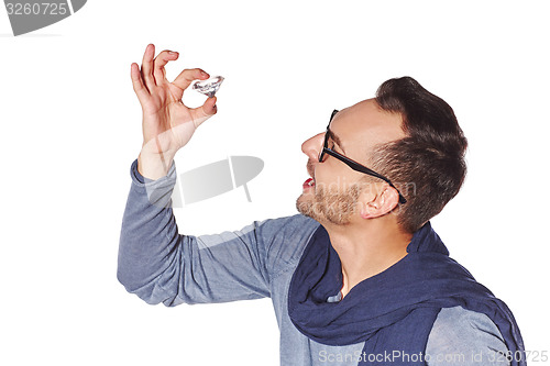 Image of Man examining big diamond