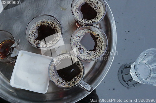 Image of Foam and bubbles form on the surface after pouring a cup of tea 90