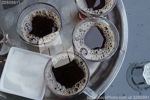 Image of Foam and bubbles form on the surface after pouring a cup of tea 91