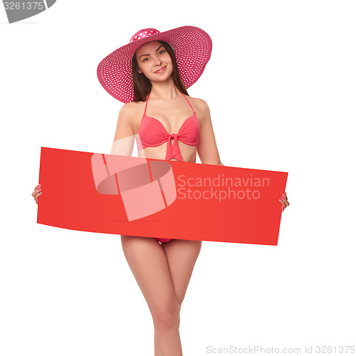 Image of Woman in swimsuit holding red blank cardboard