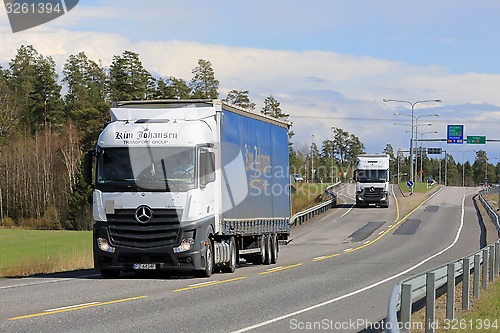 Image of Two Mercedes-Benz Actros Trucks on the Road