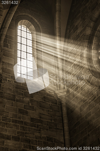 Image of church window with sunbeams