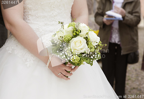 Image of Bride with bridal bouquet in her hand