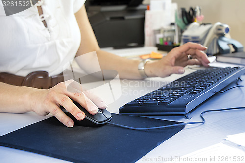 Image of Business woman typing