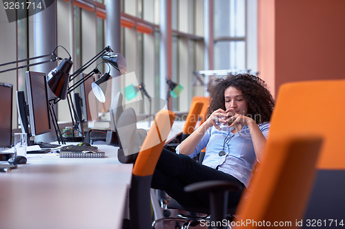 Image of relaxed  business woman have coffee break