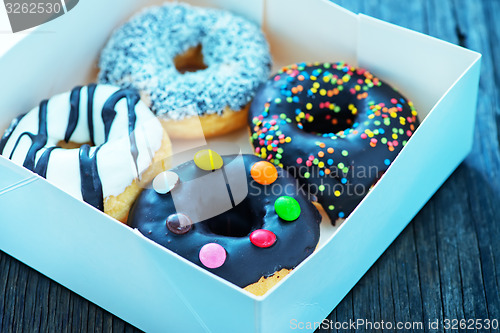 Image of donuts in white box