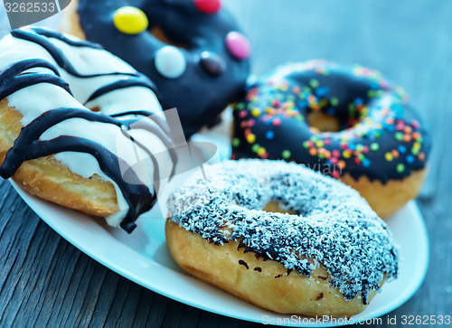 Image of donuts in white box