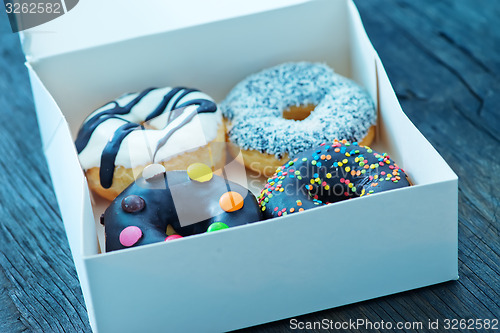 Image of donuts in white box