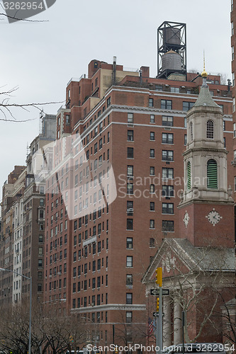 Image of Water tower by a church