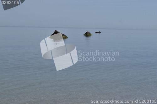 Image of Fisherman between rocks