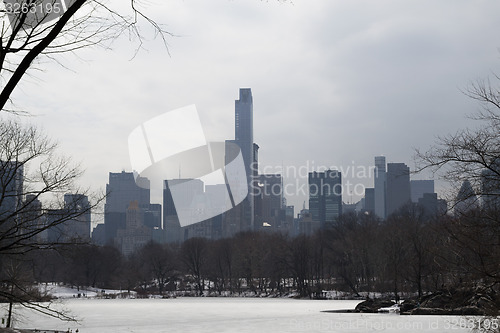 Image of Midtown in winter from Central Park by and frozen podn